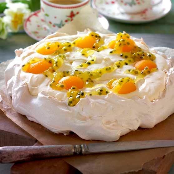 Easter Pavlova with lemon cream and passion fruit sauce